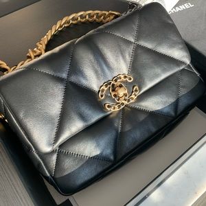 CHANEL 19 Handbag 
Lambskin, Gold-Tone, Silver-Tone & Ruthenium-Finish Metal